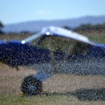 Bradelaide Multimedia Photography for the Aldinga Airfield website - light plane parked through sprinkler